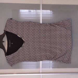 White house black market top with metal accents